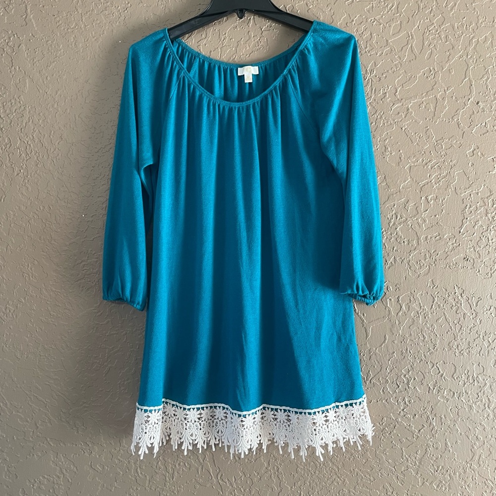Blue tunic with lacy hem